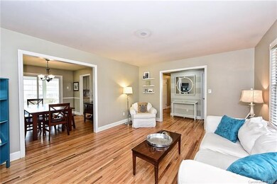 Family Room with View of Dining Room out to Sunroo