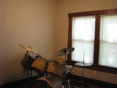 Just to the left of the front door