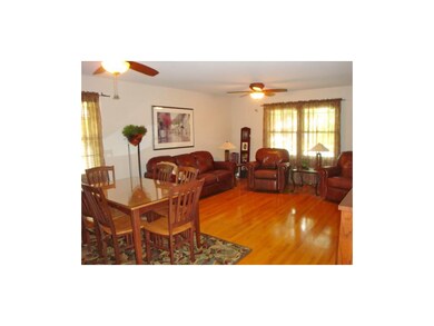 Living room/dining room with 2 ceiling fans and be