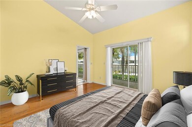Virtually Staged Bedroom featuring access to outside, wood finished floors, baseboards, high vaulted ceiling, and ceiling fan