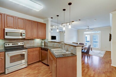 A modern open-concept kitchen and living area. The