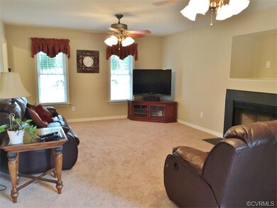 two ceilings fans and great fireplace