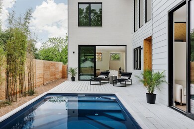 View of swimming pool featuring a deck, outdoor l