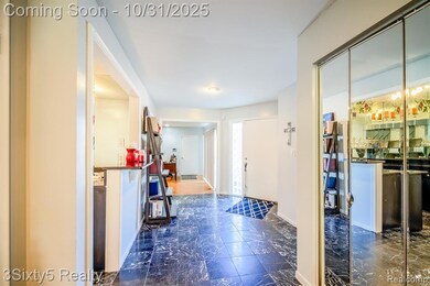 Foyer featuring dark marble finish flooring