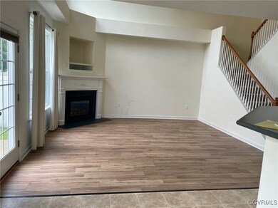 Unfurnished living room featuring a wealth of natural light and light wood-type flooring