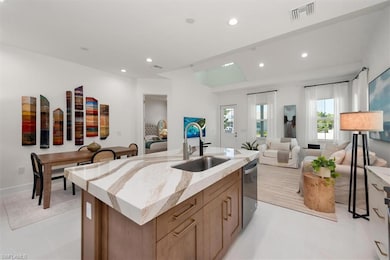 Kitchen with a sink, stainless steel dishwasher, o