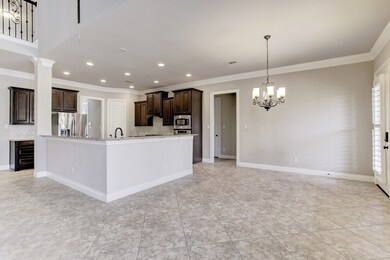 The chef-inspired kitchen is perfect for making meals for groups of any size! The open concept between the kitchen, breakfast area, and living room offers easy access.