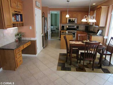 Kitchen - Another view of the Kitchen that shows off just how expansive it really is.  Desk Area has a Granite Top and same Diamond Laid Tile Backsplash. Recessed Lighting and Tasteful Pendant Lighting compliment as well.
