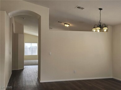 Spare room with baseboards, visible vents, a notab