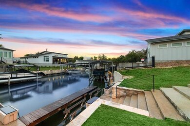 Dock area featuring fence, a water view, and a la