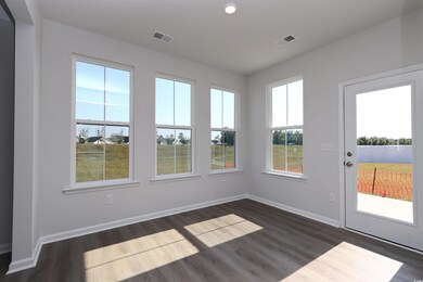 Unfurnished sunroom featuring plenty of natural li