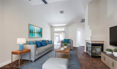 Living room featuring a tiled fireplace, a ceiling