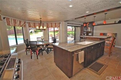 Kitchen opens to spacious dining area with bay win