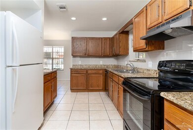 Unfurnished dining area featuring healthy amount of natural light, light tile patterned floors, and baseboards