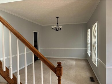 Dining room with chandelier and textured ceiling