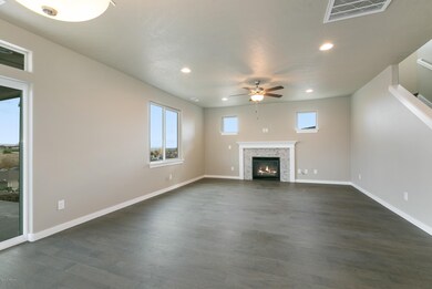 002Great room wiht fireplace and view