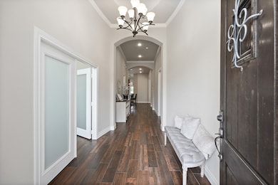 Gorgeous entry with french doors enclosing an offi