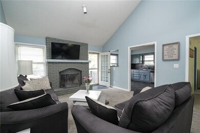Warm, inviting family room with wood burning firep
