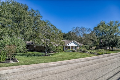 View of front of house featuring a front yard and a porch