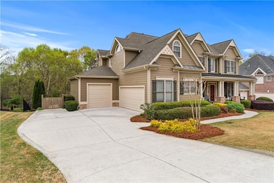 Craftsman-style house with driveway, a front yard,