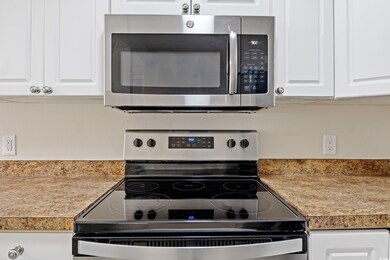 Kitchen with appliances with stainless steel finis