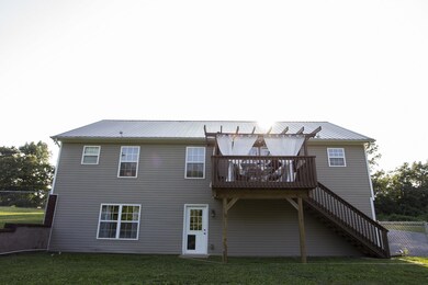 NEWLY painted back deck. Entrance to basement on ground level.