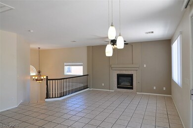 Large upstairs living area with fireplace, ceiling