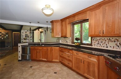View of kitchen looking into family room.
