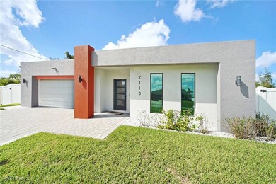 View of front of property featuring a garage and a