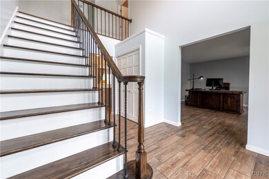 Beautiful two story foyer greets you upon entry