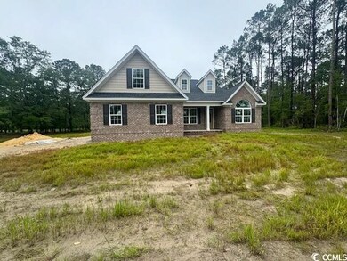 Traditional-style home with brick siding