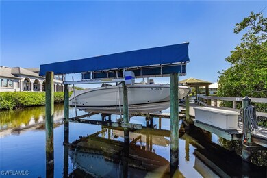 Dock with boat lift and a water view