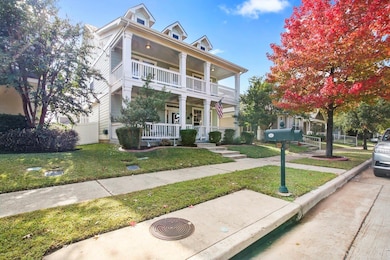 Greek revival inspired property with a front yard,