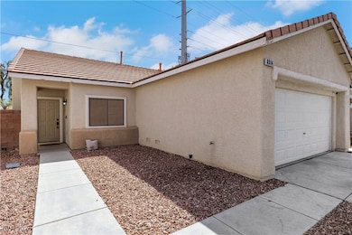 View of front of home with stucco siding, fence, a