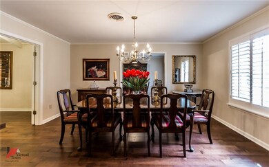 Formal dining room with wood floors