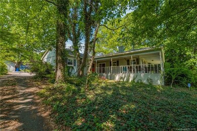 Left side front of home features Lshape wrap around porch