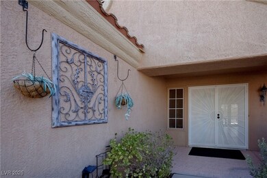 Entrance to property featuring stucco siding