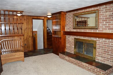 Charm abounds with the wood mantle and slate aroun