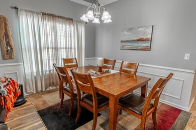 Dining area with light hardwood / wood-style floor
