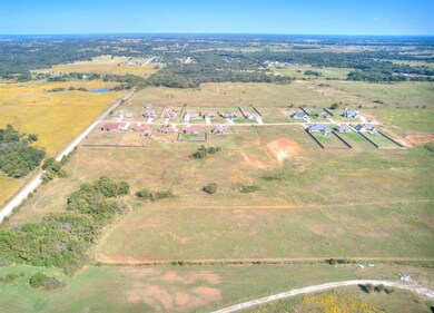 Birds eye view of property featuring a rural view