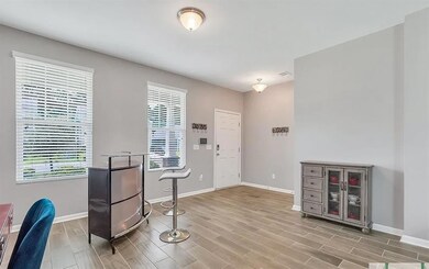 Entrance foyer with baseboards and light wood finished floors