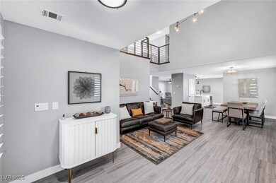 Living room with wood finished floors, baseboards,