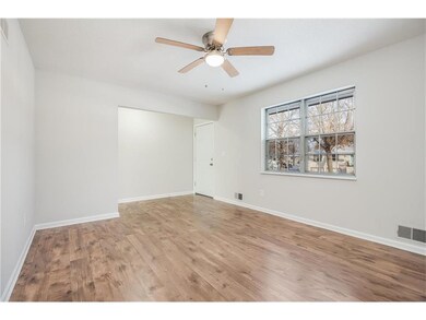 The living room is 14 x 11 with new paint, new lam