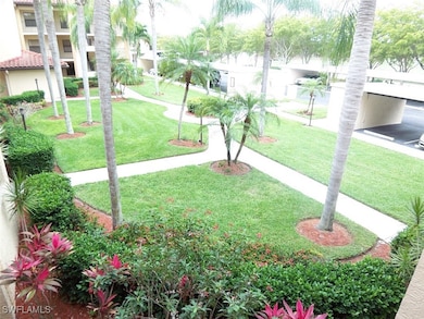 View of home's community with a lawn