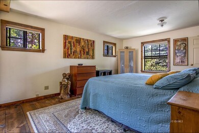 Spacious bedroom with treetop views