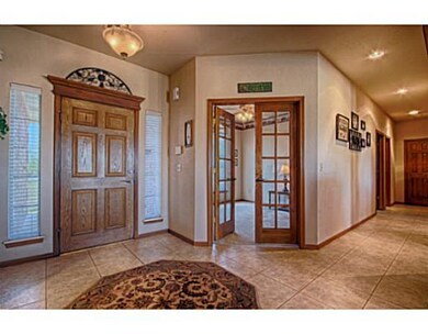 Interior Space/Layout. Tiled floor entryway into t