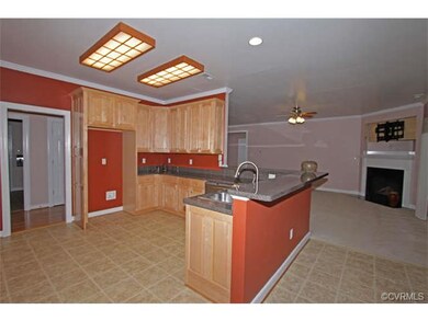 The family room opens to the kitchen with a large 