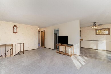 Large living overlooking deck to back yard