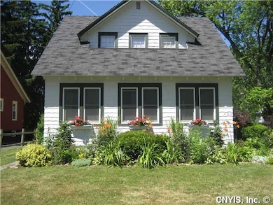 Exterior Front. Perrenial beds, window boxes and b