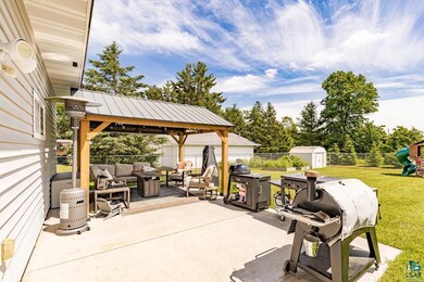 View of terrace with area for grilling, a storage 
